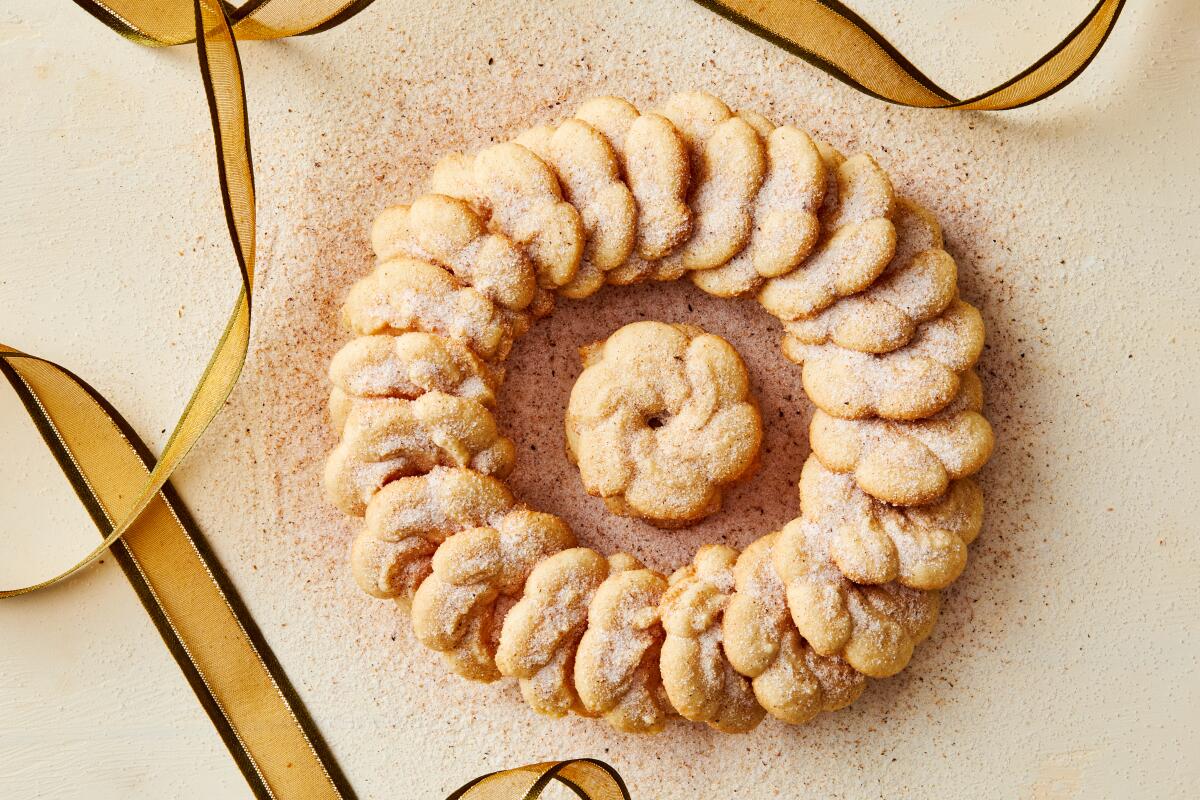 These spritz cookies are spiked with rum, cloves and lots of freshly grated nutmeg for that quintessential eggnog flavor.