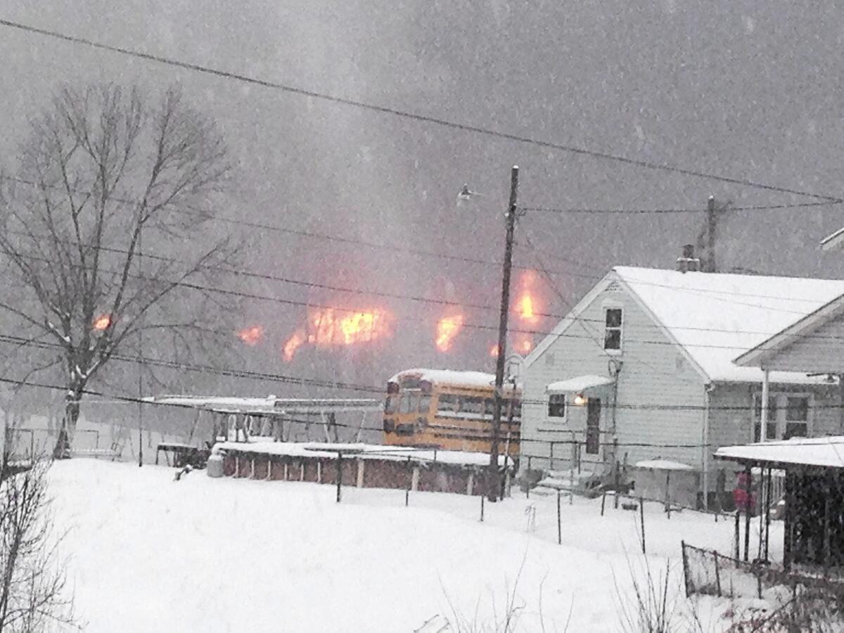 A train derailment in West Virginia started a fire that destroyed one house, and may have contaminated a river with crude oil.