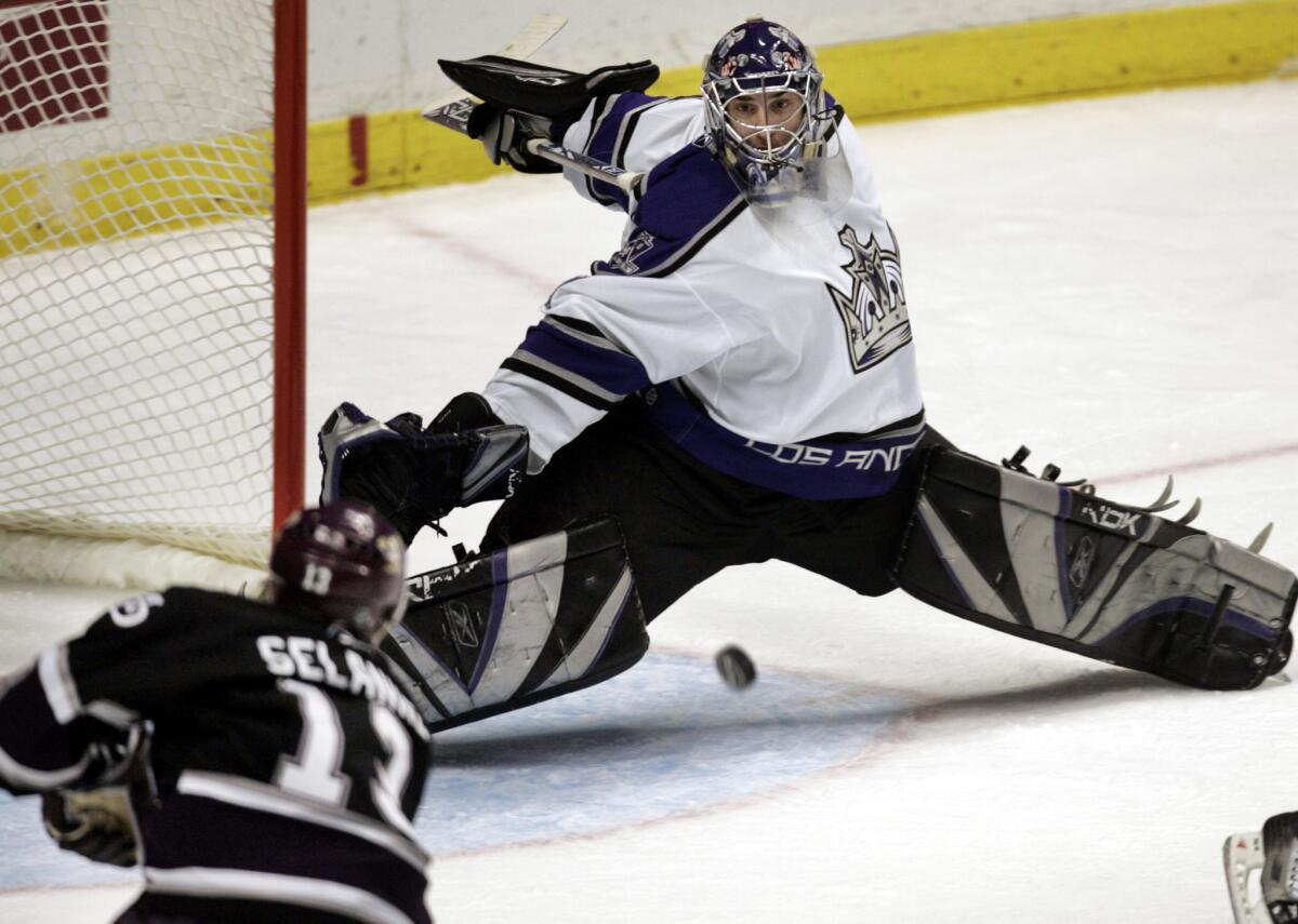 Kings goalie Mathieu Garon stops a shot from Ducks forward Teemu Selanne during the second period of a game on Dec. 16, 2005.