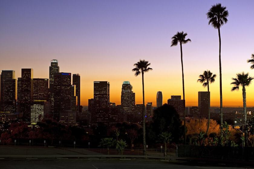 The sun sets beyond downtown Los Angeles in January 2011. Los Angeles is vying to be the sole American bidder for the 2024 Summer Games.