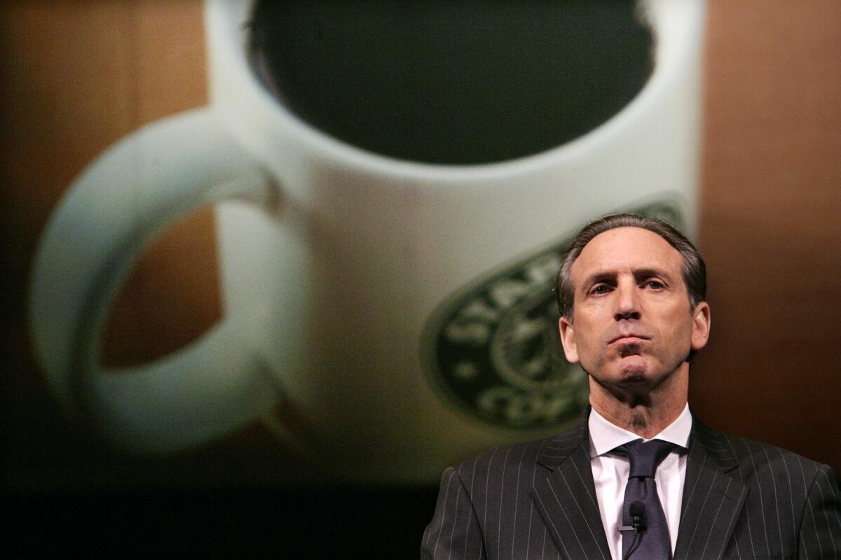 In a letter posted late Monday to the company's website, Starbucks Corp. Chief Executive Howard Schultz urged other business leaders to put pressure on Congress to end the government shutdown. Above, Schultz addresses shareholders in 2007.