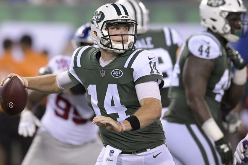 FILE - In this Friday, Aug. 24, 2018, file photo, New York Jets quarterback Sam Darnold (14) steps back to throw against the New York Giants during the second quarter of an NFL football game, in East Rutherford, N.J. Darnold is the front-runner to be the starter when the regular season opens after a solid summer and preseason. (AP Photo/Bill Kostroun, File)