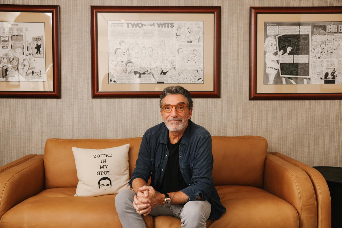 Veteran TV producer Chuck Lorre sits on a couch at his office on the Warner Bros. lot 