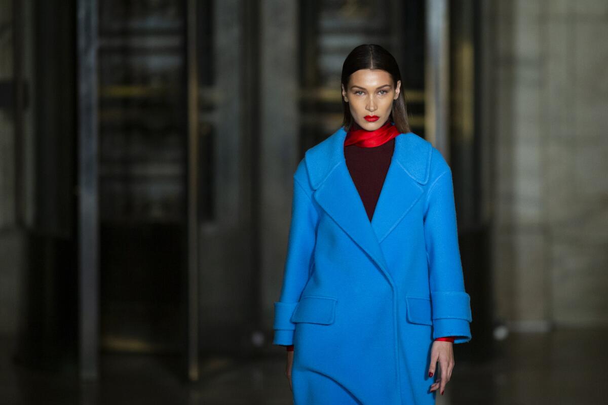 The Oscar De la Renta collection is modeled by Bella Hadid during Fashion Week, Monday, Feb. 10, 2020, in New York. (AP Photo/Eduardo Munoz Alvarez)
