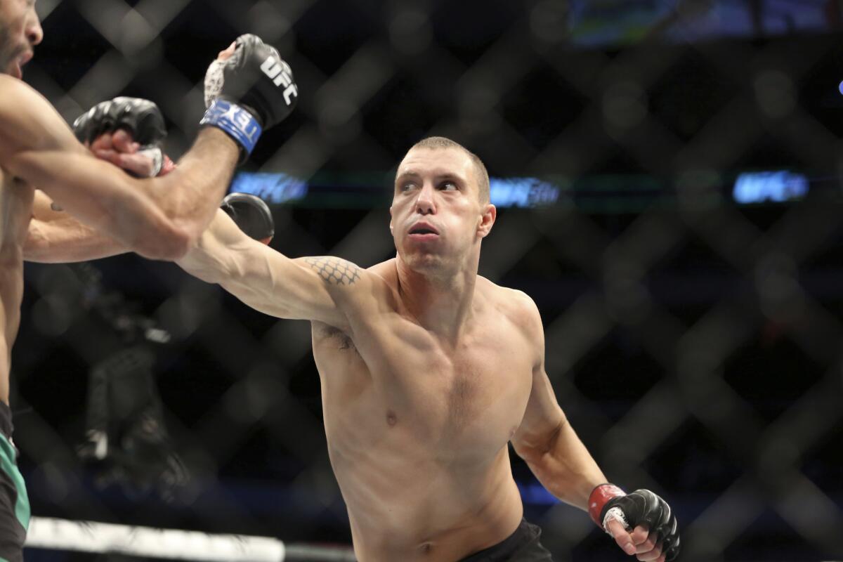 James Vick goes on the offensive against Marco Polo Reyes during their lightweight fight at UFC 211.