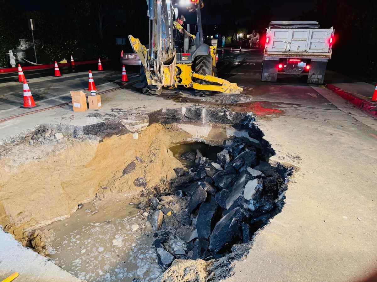 Newport Beach's utilities crew dug a deep hole in search of the water main break on Bayside Drive.