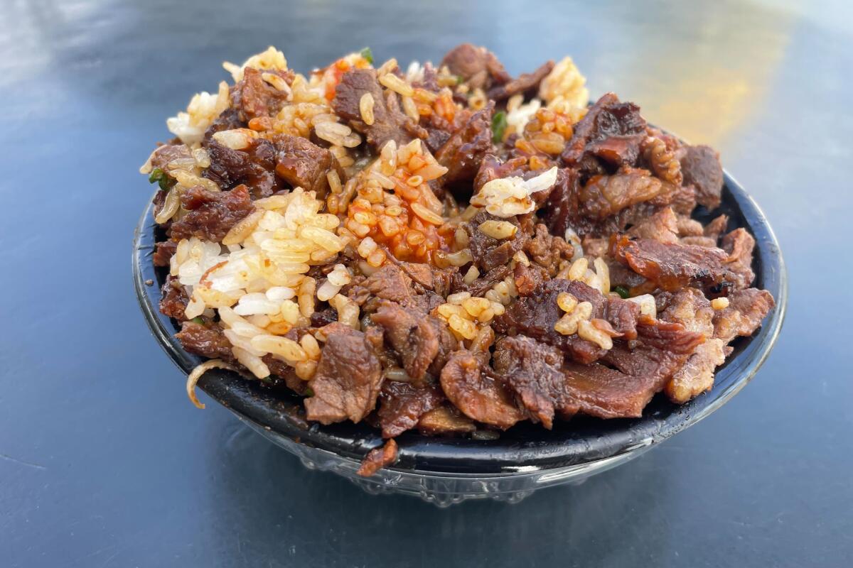 Writer and Anaheim local Gustavo Arellano's teenage years as seen in a beef teriyaki bowl from MOS 2, anointed with teriyaki sauce, and Tapatio.