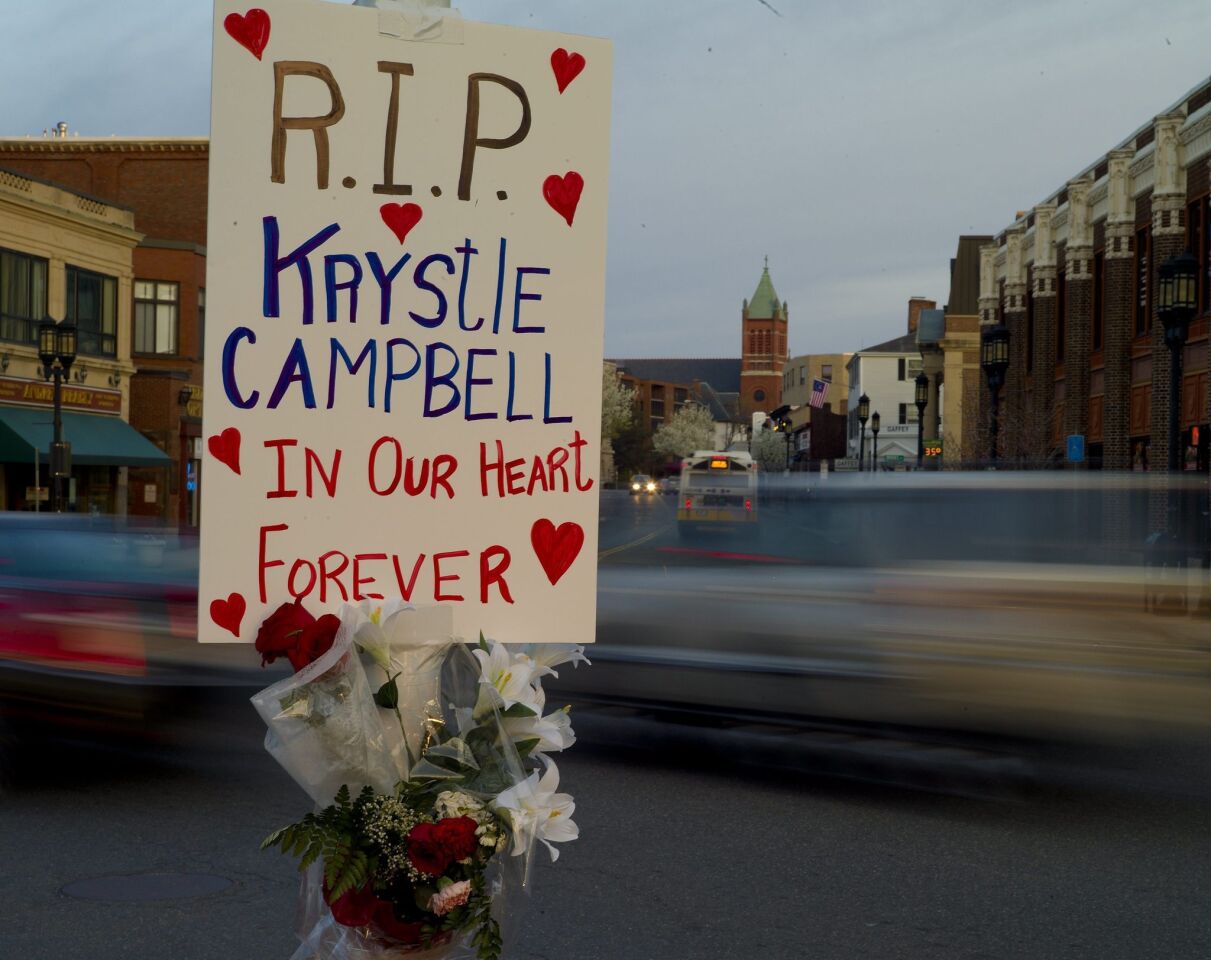 A sign in memory of bombing victim Krystle Campbell in Medford Square, near where her funeral was scheduled to be held Monday morning.