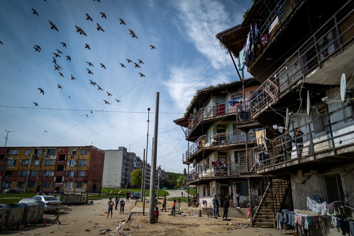 Birds fly above the Roma settlement at the Lunik IX quarter of Slovakia's second largest city of Kosice, Sunday, Sept. 5, 2021. Pope Francis will make his visit to the impoverished Roma community in Slovakia one of the highlights of his pilgrimage to "the heart of Europe." Francis will be the first pontiff to meet the most socially excluded minority group in that Central European country. (AP Photo/Peter Lazar)