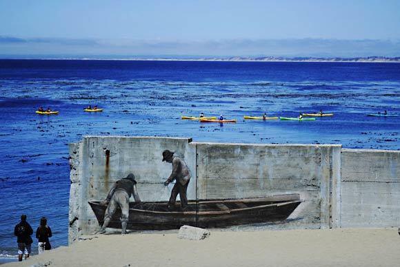 Spectators on Cannery Row's shoreline watch as kayakers row across Monterey Bay.