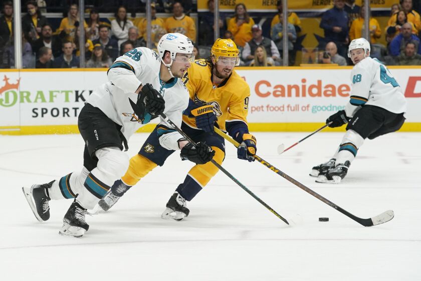 FILE - San Jose Sharks' Timo Meier (28) and Nashville Predators' Matt Duchene (95) chase the puck in the second period of an NHL hockey game Tuesday, April 12, 2022, in Nashville, Tenn. The San Jose Sharks and the Nashville Predators will play regular-season openers on Friday, Oct. 7 and Saturday, Oct.8 at Prague’s O2 Arena as part of the NHL's return to Europe for the first time since the start of the pandemic. (AP Photo/Mark Humphrey, File)