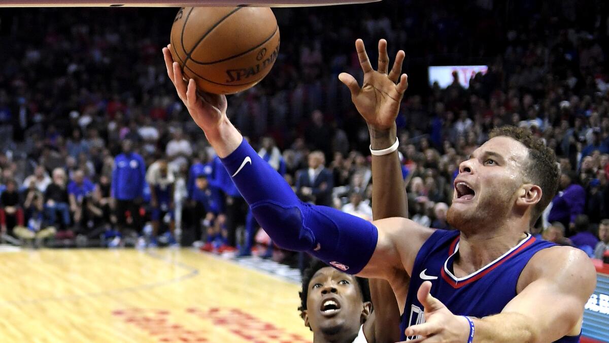 Clippers forward Blake Griffin tries to score along the baseline against Heat forward Josh Richardson during the second half Sunday.