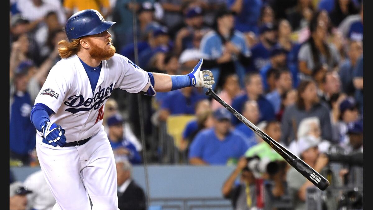 Dodgers third baseman Justin Turner hits a solo home run against Cubs pitcher Jake Arrieta in the sixth inning in Game 3 of the NLCS.