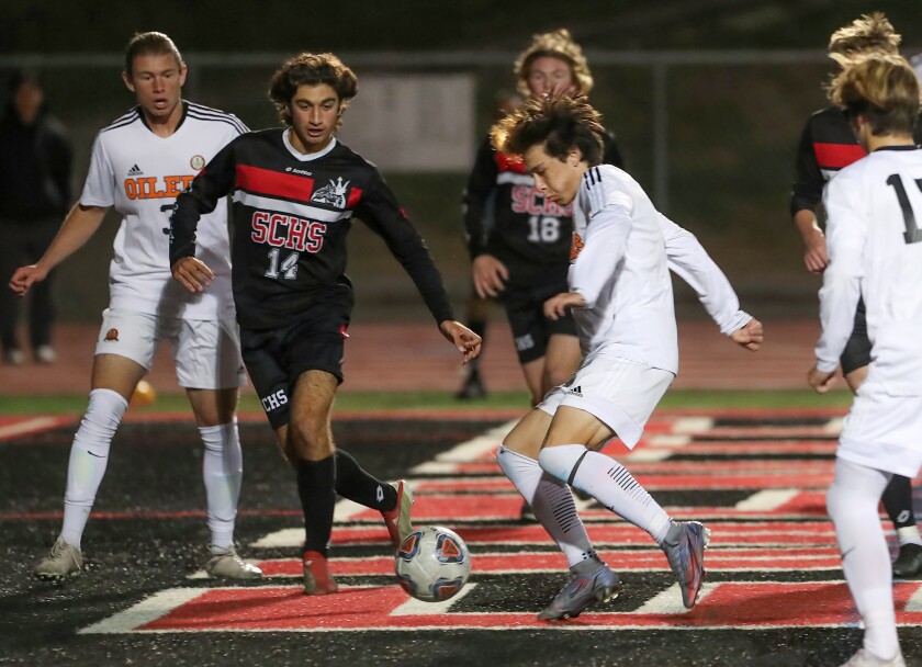 Carson Dykes of Huntington Beach takes a shot from the box and scores against San Clemente on Tuesday.