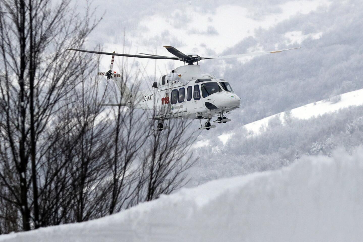 A helicopter approaches the area in Rigopiano, central Italy, where a hotel was buried under an avalanche. Rescue workers were searching for survivors who had been buried under the debris.