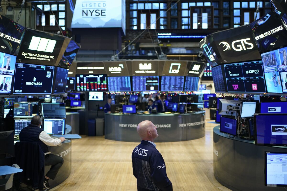 Traders work on the floor at the New York Stock Exchange.