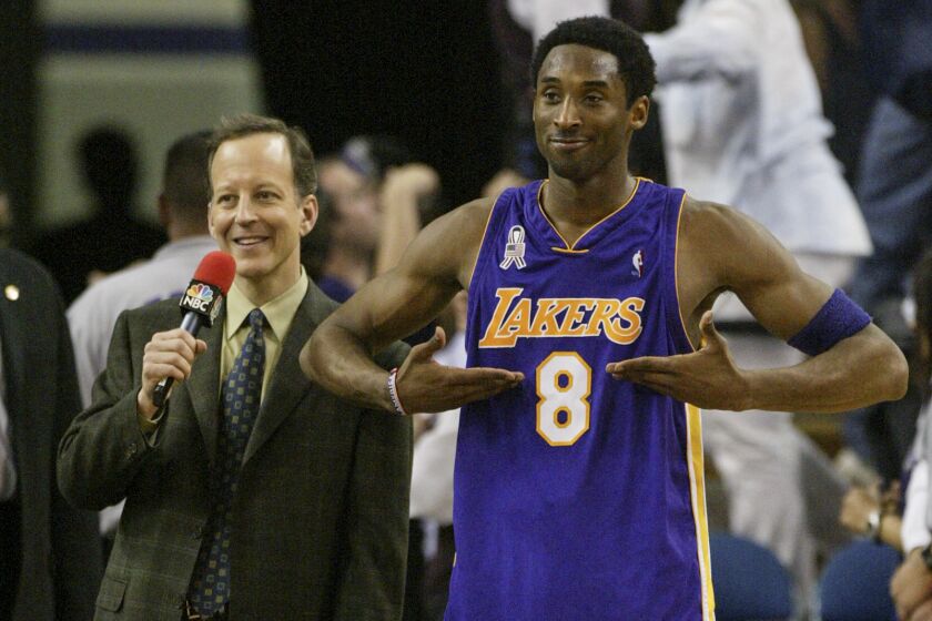 SACRAMENTO, CA, MARCH 23, 2002 - Kobe Bryant interacts with fans before a tv interview with Jim Gray.