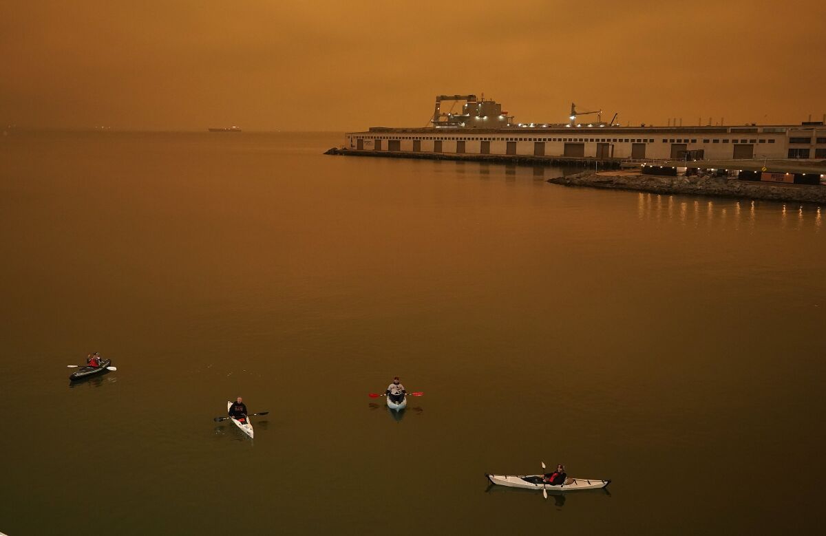 Kayakers paddle in McCovey Cove outside San Francisco's Oracle Park on Wednesday.