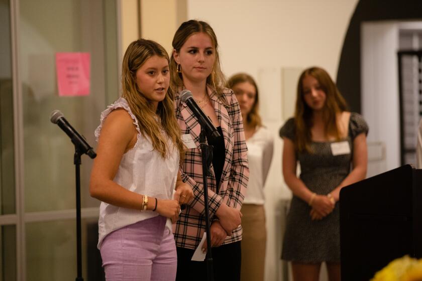 The Bishop’s School students Simmons Arnold and Charlie Johnson speak about their project to help the homeless in San Diego during the First Annual Homelessness Innovation Challenge at The Bishop’s School in La Jolla on Monday, May 2, 2022. The event, hosted by non-profit Lucky Duck Foundation, offered students from several schools to pitch projects that would help the homeless population in San Diego. Selected winners would receive money to continue their projects.