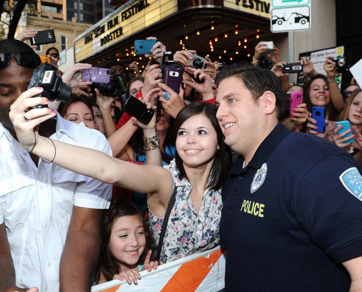 Jonah Hill gets close to fans at the "21 Jump Street" premiere in downtown Austin.