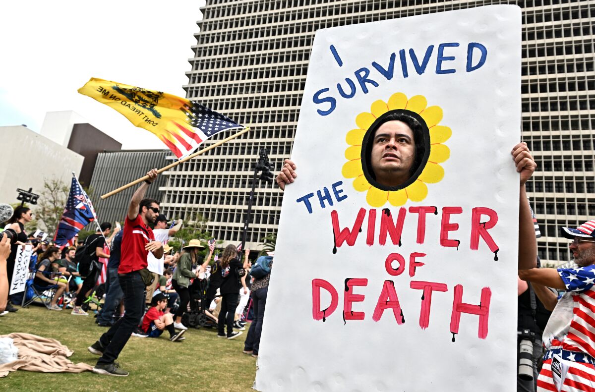 Los Angeles, California April 10 2022-People rally against vaccine mandates at Grand Park Sunday.