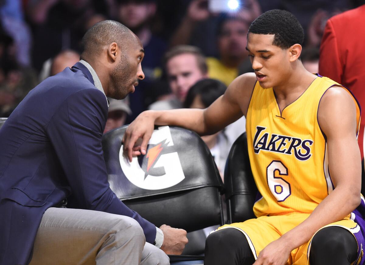 Kobe Bryant talks to rookie Jordan Clarkson during a March 10 game against the Detroit Pistons at Staples Center.