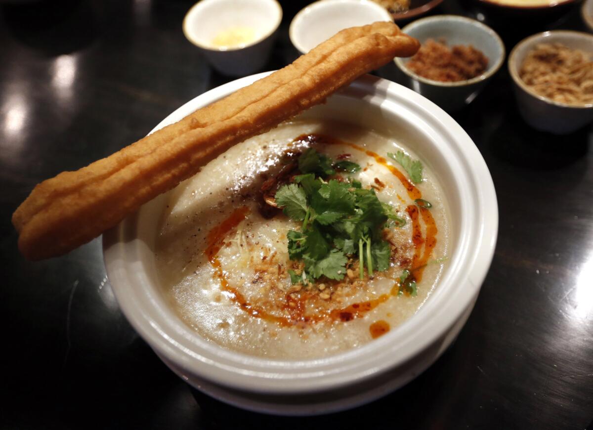 Chef Tin Vuong's congee is accompanied by a Chinese savory doughnut.