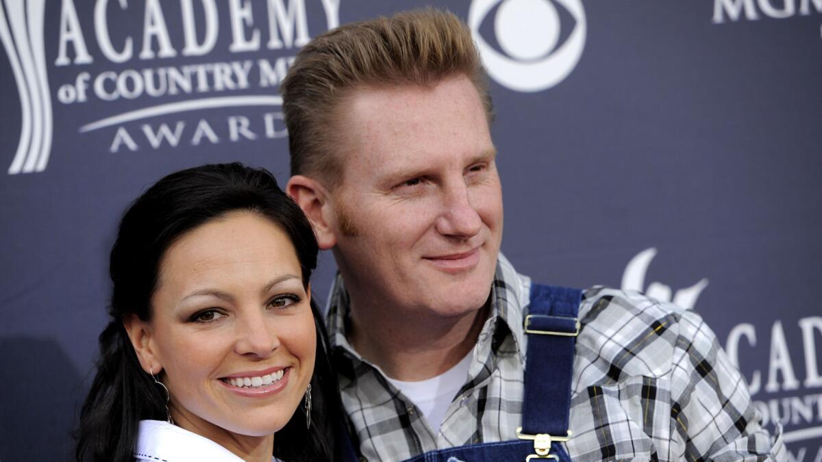 In this April 3, 2011, file photo, Joey Feek and husband Rory, of Joey + Rory, arrive at the 46th annual Academy of Country Music Awards in Las Vegas.