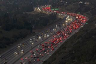 LOS ANGELES, CA - November 23, 2022 - Brake lights shine red as northbound 405 traffic backs up in the Sepulveda Pass on Wednesday, Nov. 23, 2022 in Encino, CA. AAA predicts that 54.6 million people will travel at least 50 miles from home in the U.S. this week, a 1.5% bump over Thanksgiving last year and only 2% less than in 2019. The auto club and insurance seller says nearly 49 million of those will travel by car, and 4.5 million will fly between Wednesday and Sunday. (Brian van der Brug / Los Angeles Times)