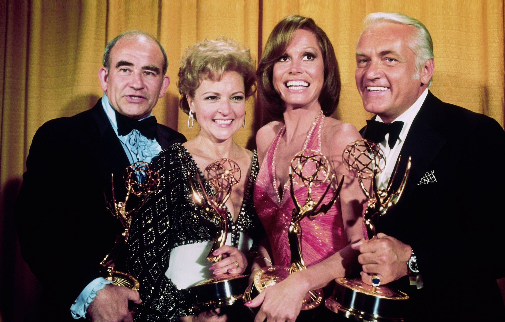Cast members of the "Mary Tyler Moore Show" pose with their Emmys on May 18, 1976. 