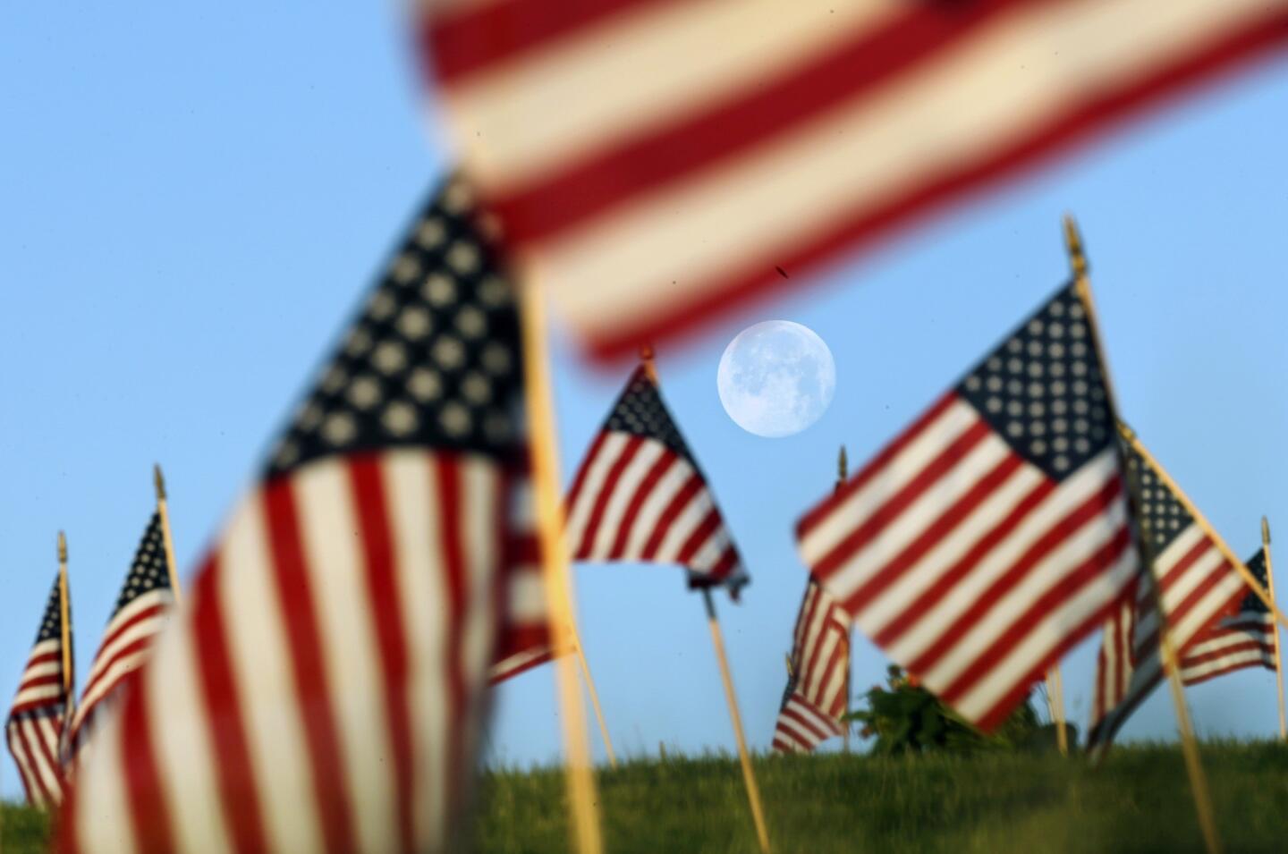 The moon over flags in New Jersey