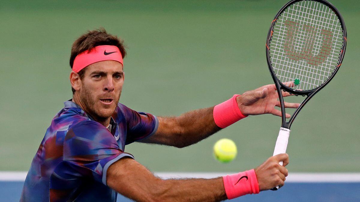 Juan Martin del Potro hits a return shot to Dominic Thiem during the fourth round of the U.S. Open tennis tournament on Monday.
