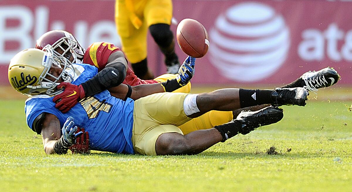 USC cornerback Adoree' Jackson breaks up a pass intended for UCLA receiver Darren Andrews.