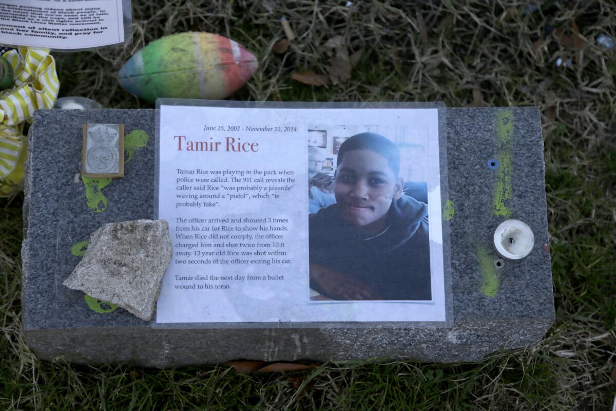 A memorial for Tamir Rice is seen at the base of the Gen. Robert E. Lee statue in Richmond, Va.