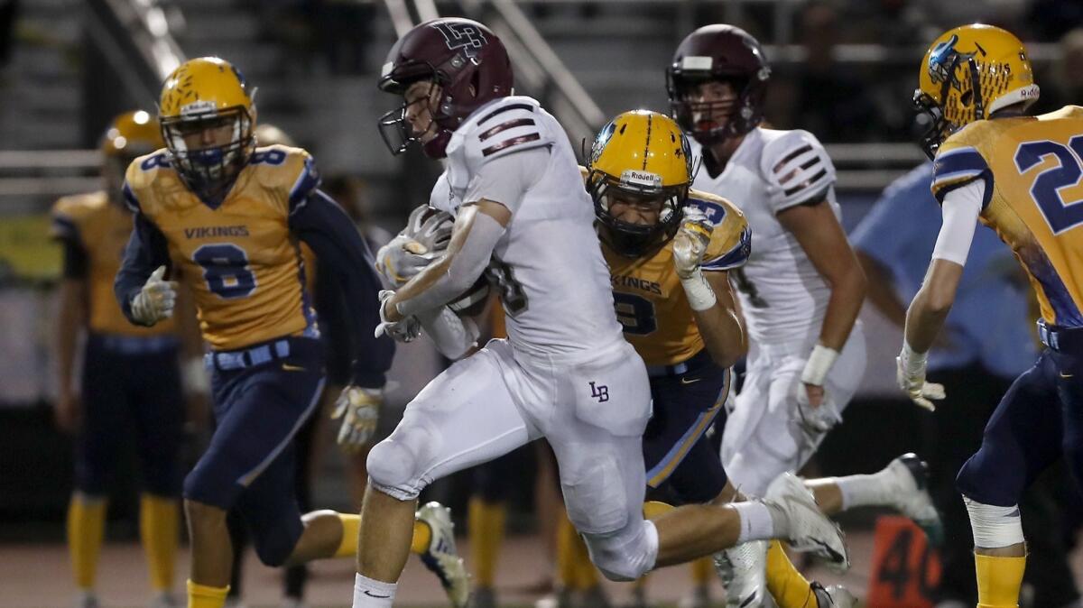 Laguna Beach High running back Shane Lythgoe, shown running the ball against Marina on Sept. 28, caught the game-winning touchdown in the Breakers' 49-46 win over Arcadia Rio Hondo Prep on Friday.