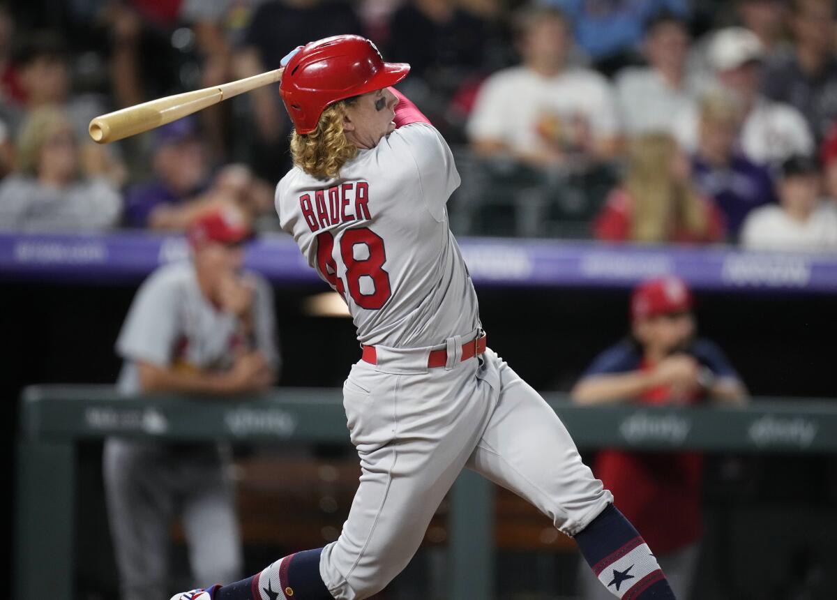 St. Louis Cardinals' Harrison Bader follows through on a three-run home run off Colorado Rockies relief pitcher Yency Almonte during the 10th inning of a baseball game Friday, July 2, 2021, in Denver. (AP Photo/David Zalubowski)