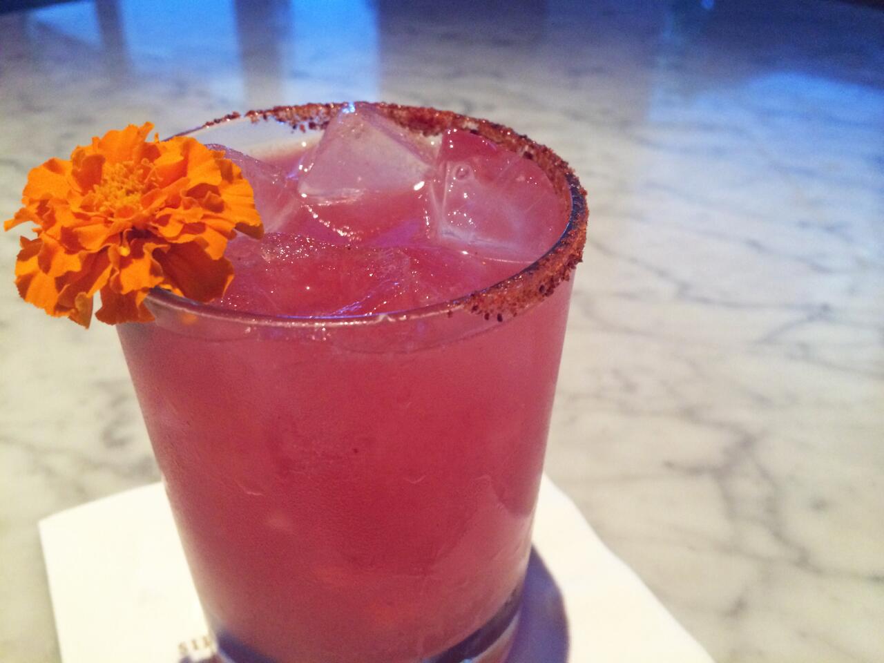 The Jasmine Margarita with Casamigos tequila, pomegranate and sal de gusano.