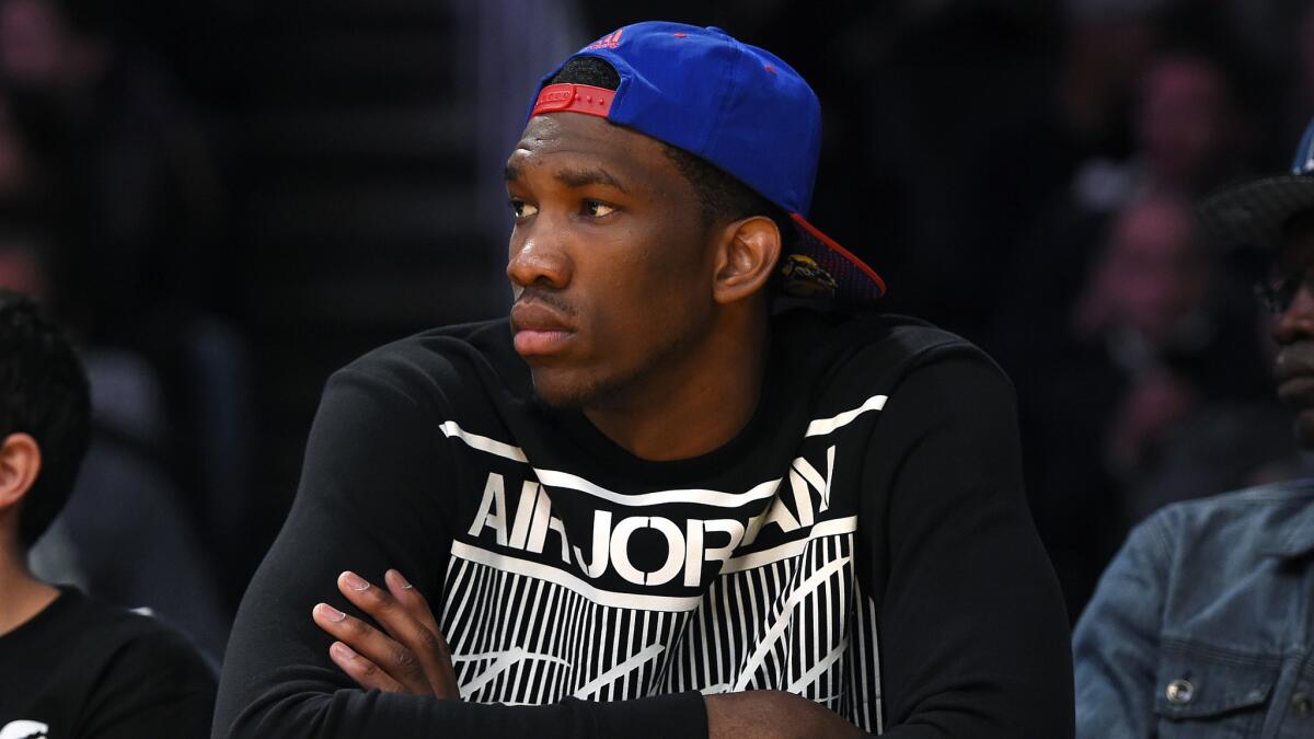 Kansas center Joel Embiid watches the Lakers play the Memphis Grizzlies at Staples Center in April.