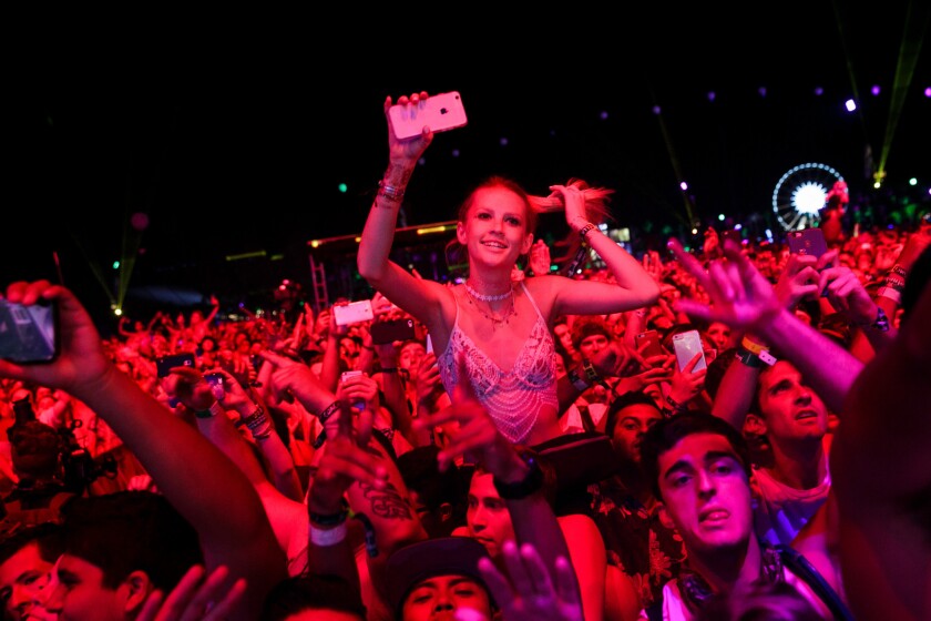Fans react Saturday to the Swedish musical duo Axwell/Ingrosso at Coachella.