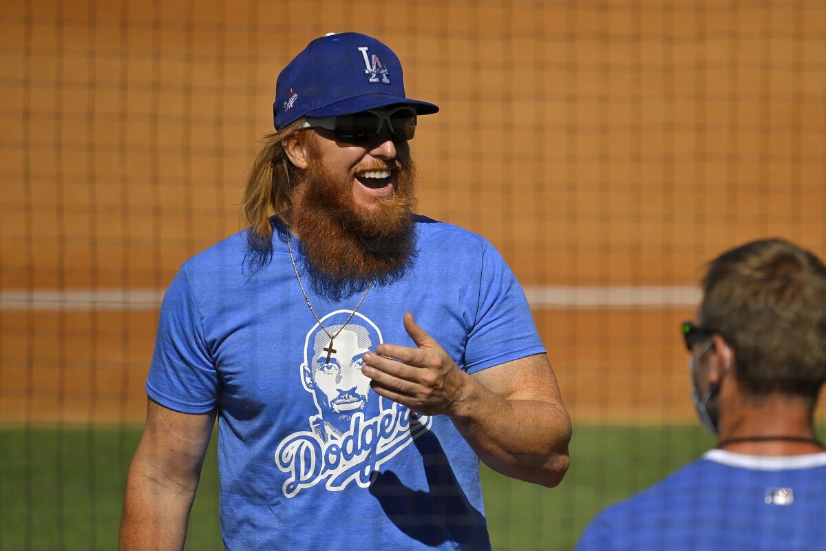 Dodgers third baseman Justin Turner laughs during team training at Dodger Stadium.