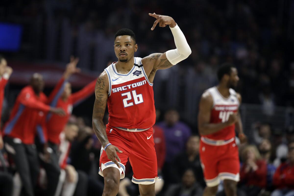 Kings guard Kent Bazemore reacts after scoring against the Clippers during the first half of a game on Feb. 22, 2020.