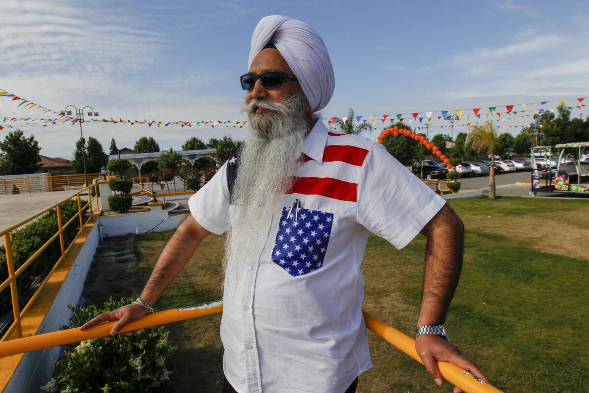 Gurcharan Singh, 63, celebrates a holiday parade at his gurdwara. (Irfan Khan / Los Angeles Times)