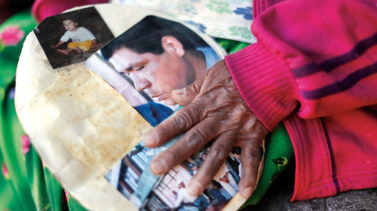 The mother of Isidro Baldenegro Lopez holds a picture of her son.