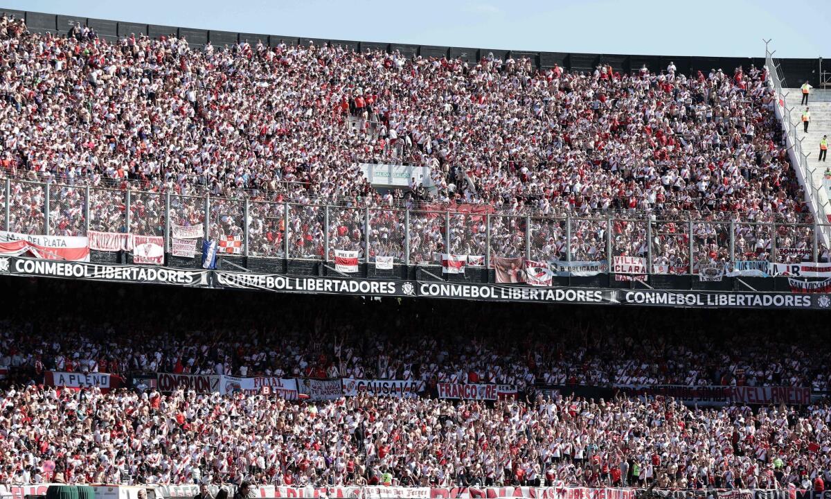 Supporters of River Plate cheer at the Monumental stadium in Buenos Aires, on November 24, 2018 while authorities decide if the second leg match of the all-Argentine Copa final between River and Boca Juniors is played after an attack on the Boca Juniors team bus by River Plate fans. - The attack left Boca players coughing and teary eyed amid the glass of smashed windows ahead of the Argentine giants' "superclasico" Copa Libertadores final. (Photo by Alejandro PAGNI / AFP)ALEJANDRO PAGNI/AFP/Getty Images ** OUTS - ELSENT, FPG, CM - OUTS * NM, PH, VA if sourced by CT, LA or MoD **