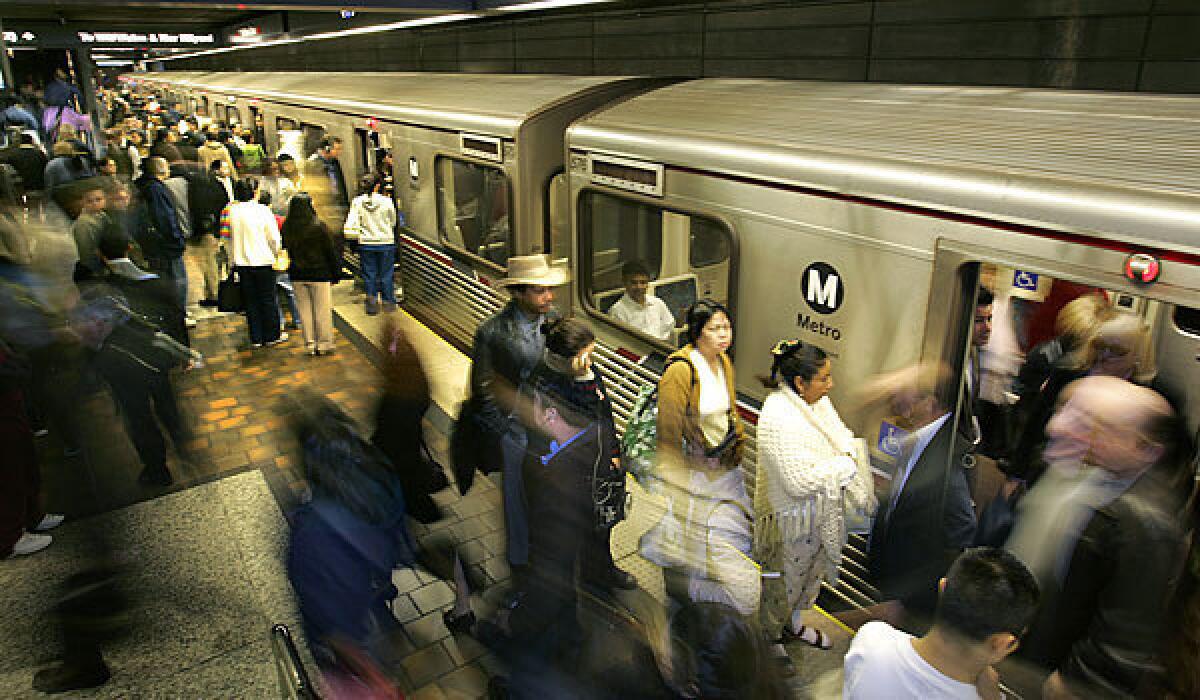 Riders crowd a platform at the 7th Street Metro Station.