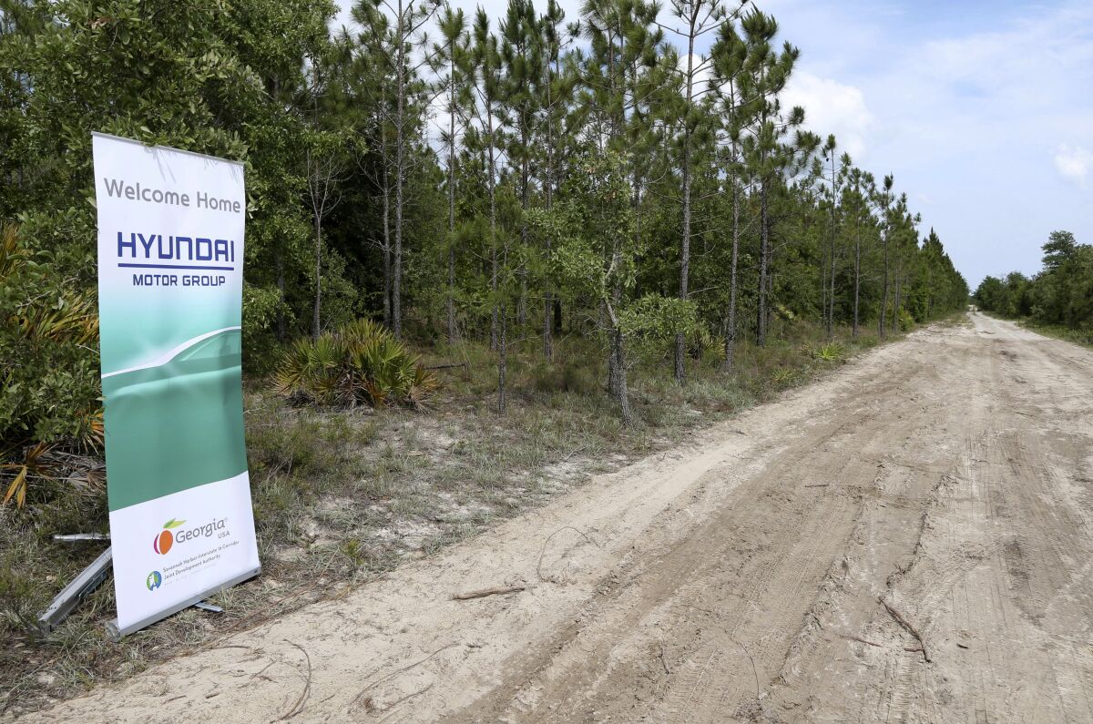 FILE - A banner welcomes Hyundai Motor Group to their future home at the Bryan County mega-site in Ellabell, Ga., Friday, May 20, 2022. Georgia officials are close to finalizing a deal with the automaker to build a $5.5 billion electric car plant near Savannah, Ga. An economic development agency representing four Savannah-area counties approved its portions of the agreement Tuesday, July 19, 2022, including an economic incentives package. (Richard Burkhart/Savannah Morning News via AP, File)