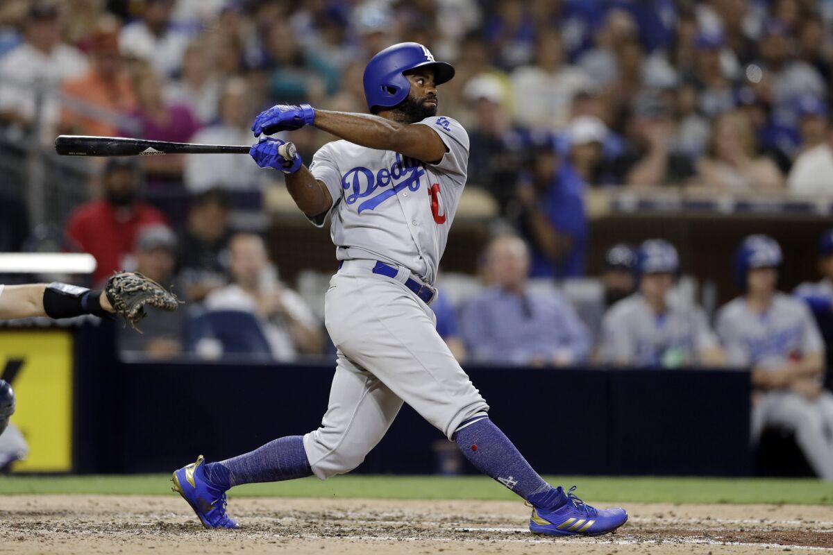 Los Angeles Dodgers' Andrew Toles watches his RBI single.