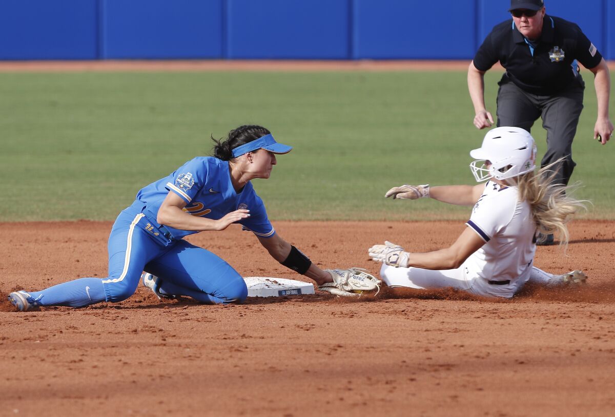 UCLA shortstop Briana Perez tags out Northwestern's Skyler Shellmyer at second base during the first inning June 3, 2022.