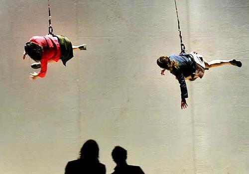HANG IN THERE: Members of Argentina's De La Guarda group perform a piece called "Villa Villa" on stage at the El Campin Coliseum during the Ibero American Theater Festival in Bogota, Colombia, on Tuesday.