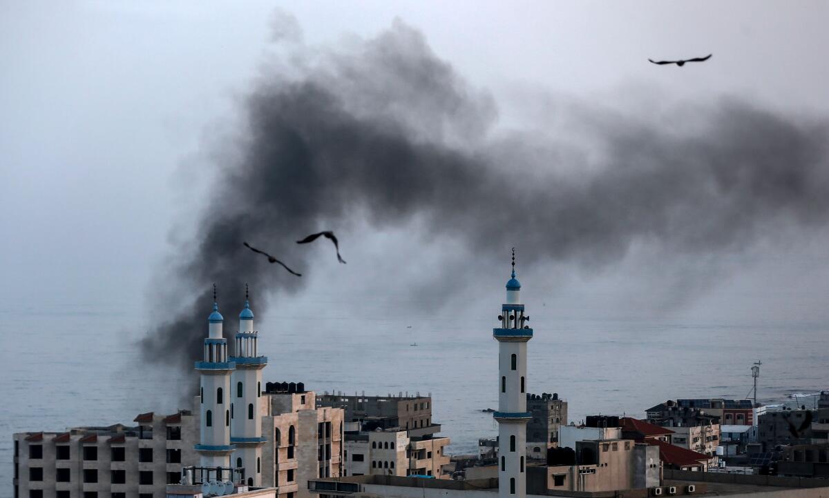Smoke rises from a building in Gaza City after an Israeli airstrike.